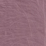 Close-up of a textured purple fabric surface