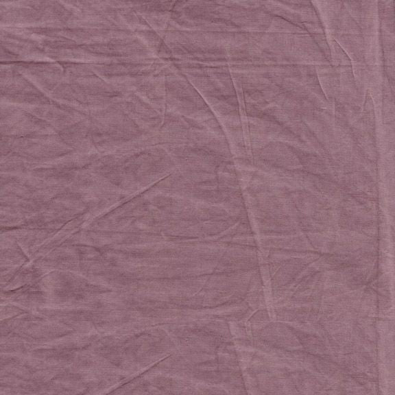 Close-up of a textured purple fabric surface