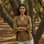 Woman standing in a forest with trees and natural light