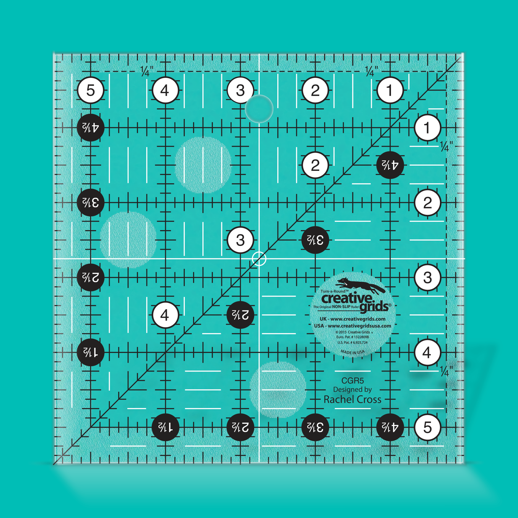 Quilting ruler with grid lines and measurements on a teal background