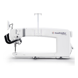 White long-arm quilting machine with 'Handi Quilter' branding on a white background