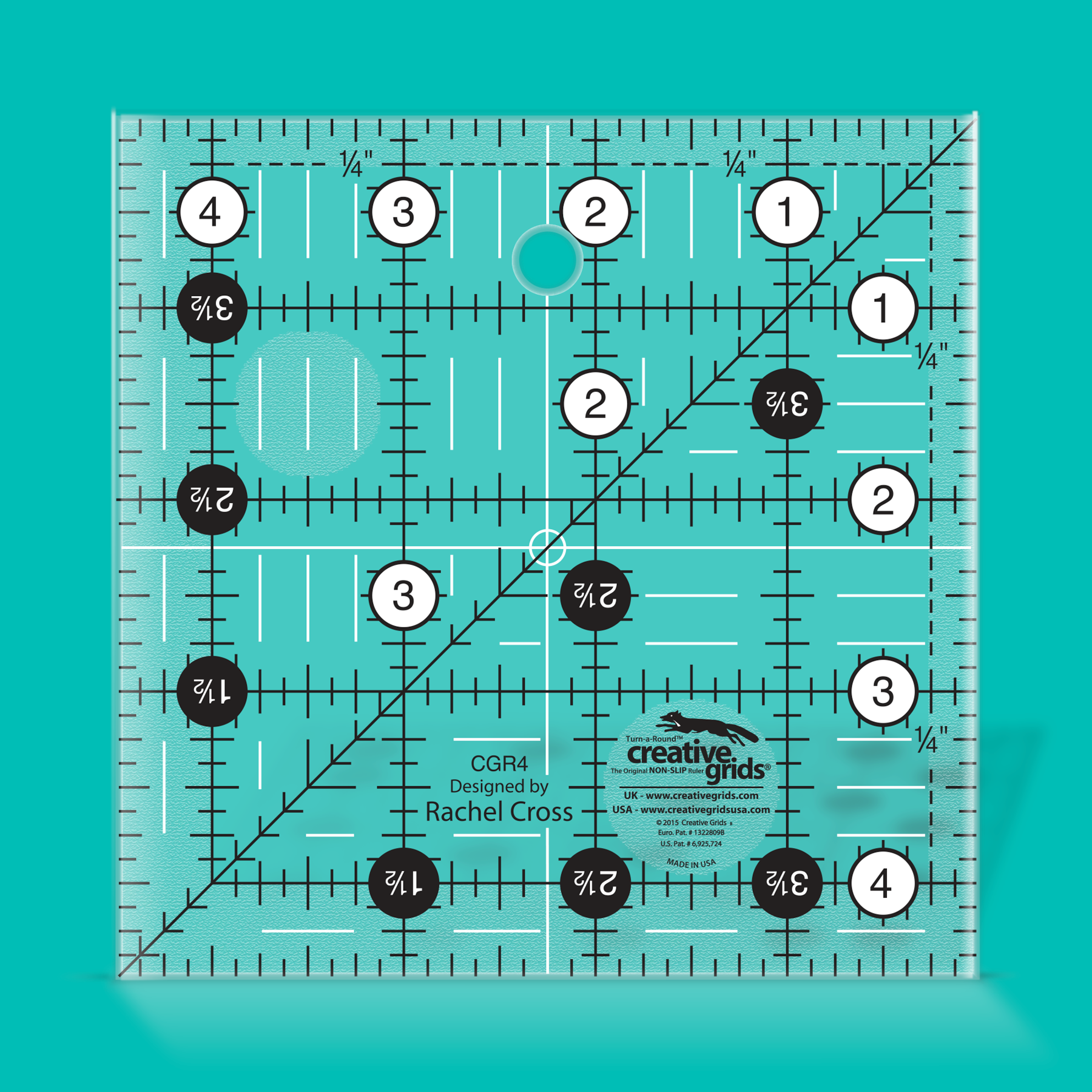 Quilting ruler with measurements on a teal background