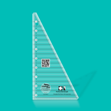 Clear acrylic ruler with measurement markings on a teal background