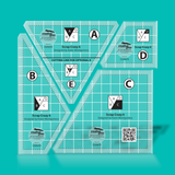 Set of four clear acrylic rulers with grid lines on a teal background