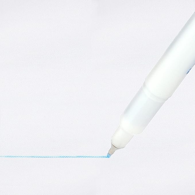 White pen writing on a light gray background