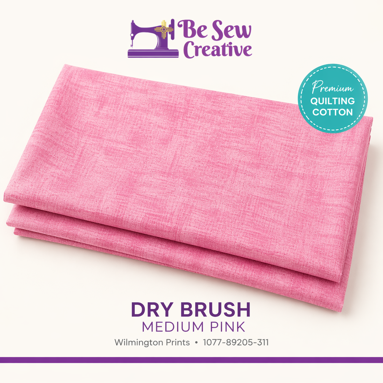 Stack of pink fabric with 'Be Sew Creative' branding on a white background