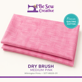 Stack of pink fabric with 'Be Sew Creative' branding on a white background