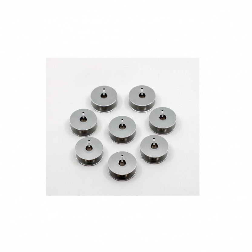 Set of eight metallic spools on a white background