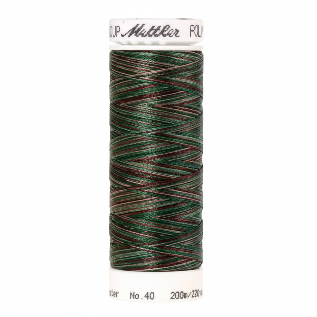 Spool of green and brown thread with Mettler branding on a white background