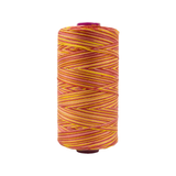 Spool of Fruitti Serenade FT4-09 12wt variegated Egyptian cotton thread featuring soft blended pink, rose, and peach tones with gentle color variation.