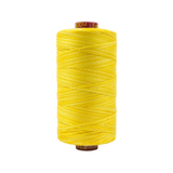 Spool of Fruitti Sunny FT4-01 12wt variegated Egyptian cotton thread featuring bright sunny yellow tones with soft warm variation.