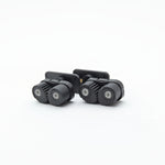 Two black camera mount brackets on a white background