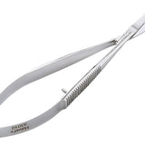 Hairdressing scissors with a comb on a white background