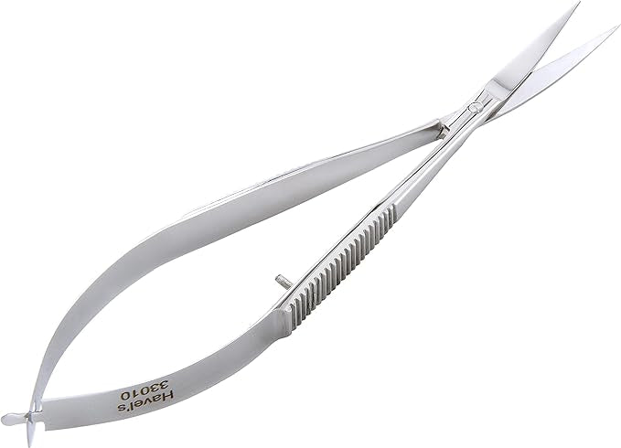Hairdressing scissors with a comb on a white background