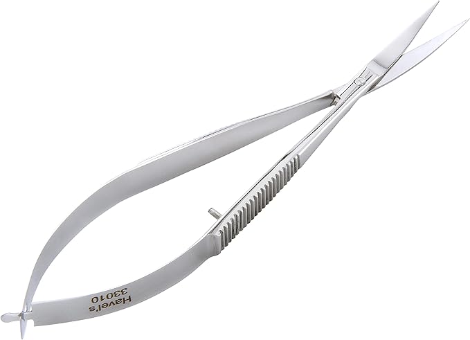 Hairdressing scissors with a comb on a white background