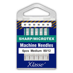 Klasse' machine needles packaging with six needles inside on a blue background