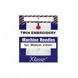 Klasse twin embroidery machine needle packaging with needle and packaging details.
