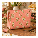 Quilted accent pillow featuring Ladybug Whimsy Zinnias Black fabric with large coral, pink, cream and golden flowers by Gingiber for Moda.