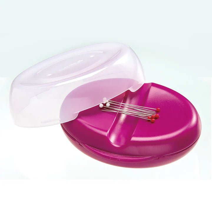 Pink and clear case with needles on a white background