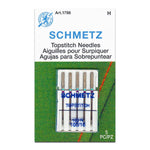 Pack of Schmetz topstitch needles on a green background with brand logo.