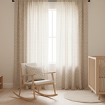 Fabric decorated with a pattern of small suns decorating a child's nursery.