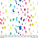 Colorful paint splatter pattern on a white background with a ruler at the bottom.