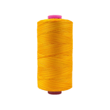 Spool of Tutti Oranges TU1-07 50wt variegated Egyptian cotton thread featuring warm orange and golden tones with soft color variation.