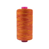 Spool of Tutti Serenade TU1-09 50wt variegated Egyptian cotton thread featuring soft blended pink, rose, and peach tones with gentle color variation.
