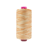 Spool of Tutti Sweet Potato TU1-08 50wt variegated Egyptian cotton thread featuring warm golden orange and earthy brown tones with soft color variation.