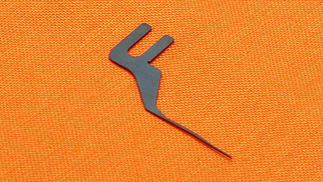 Gray logo on an orange textured background