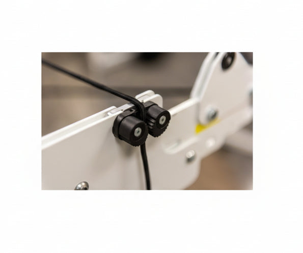 Close-up of a mechanical component with black connectors on a blurred background